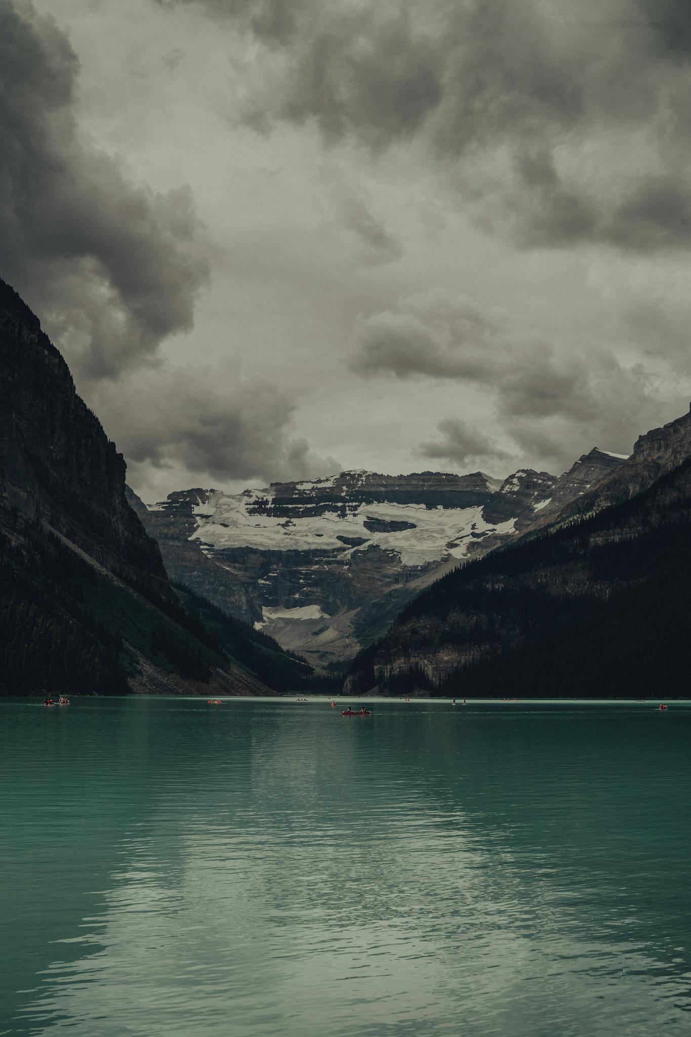 A lake with mountains in the background